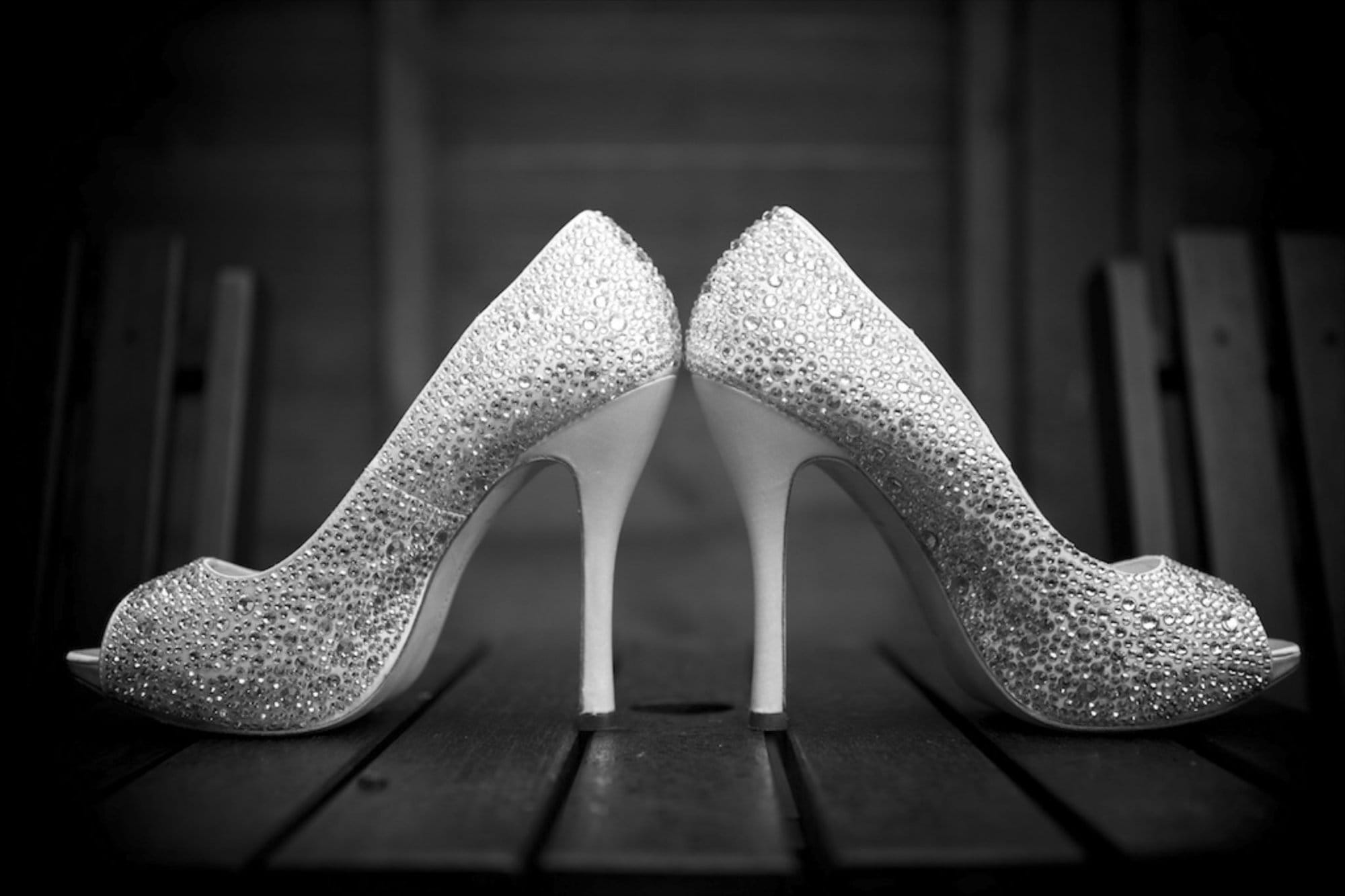 Black and white Bromley wedding photography image of brides shoes