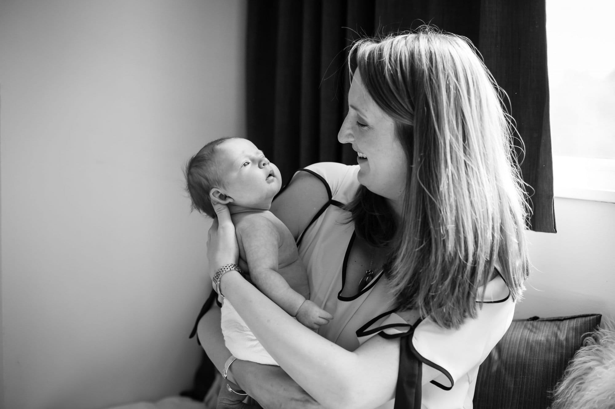 Mum cradling daughter in baby photoshoot in London