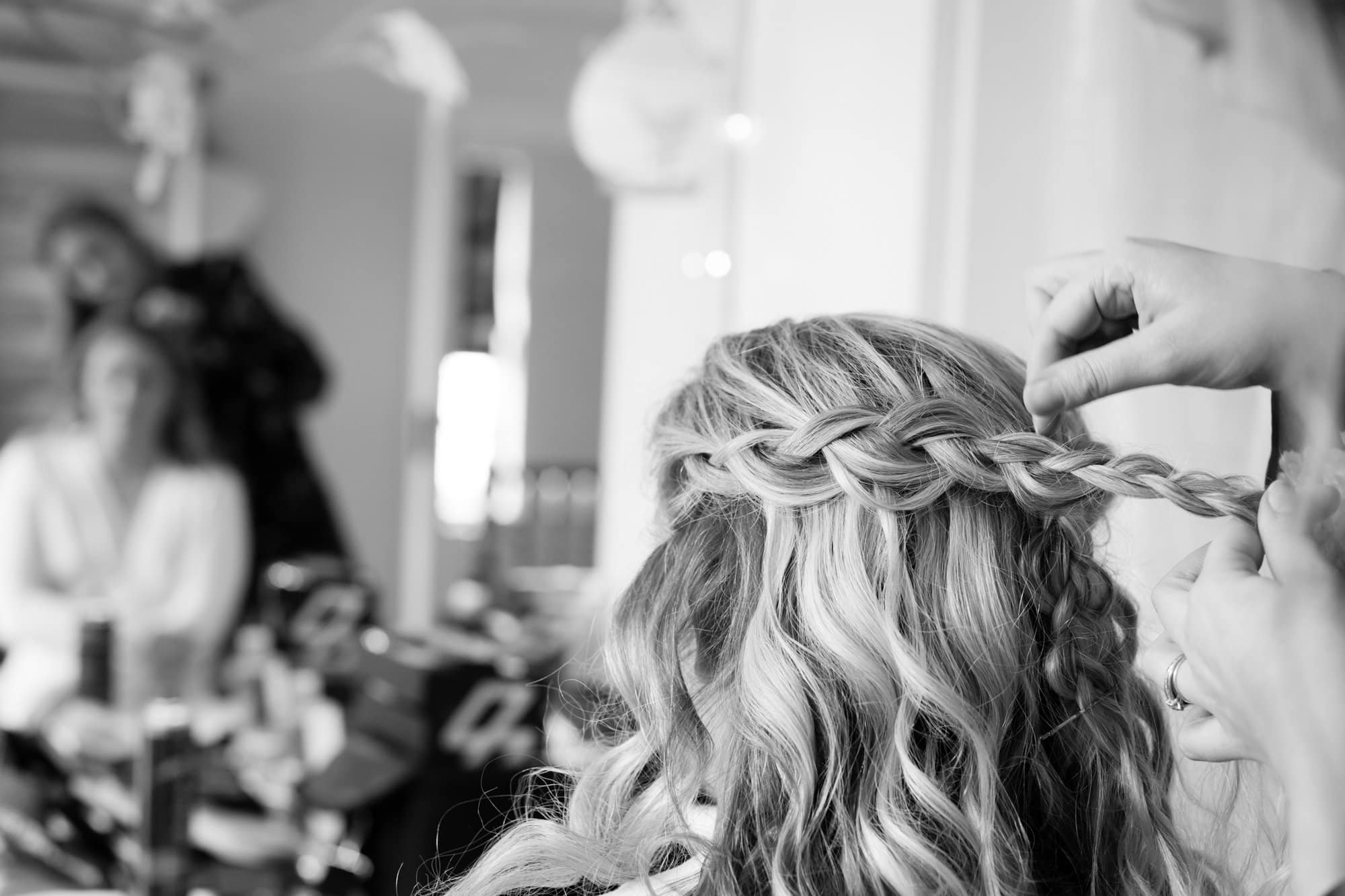 Bromley wedding photography of bridal hair preparation at brides house in Bromley in black and white