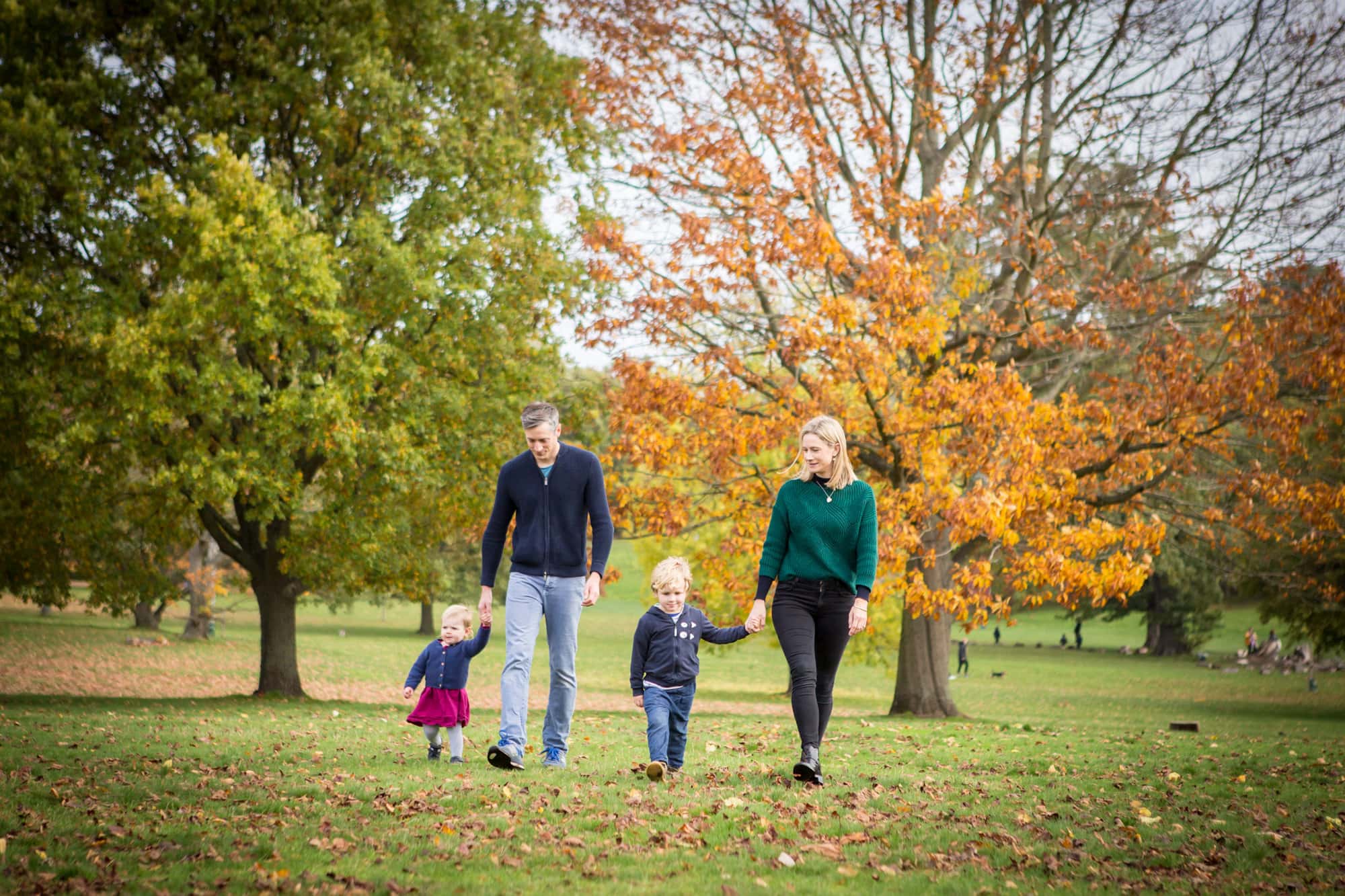 Family walking in park in London photoshoot