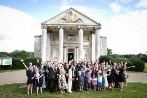 group photo of all wedding guests outside Beckenham Place Mansion