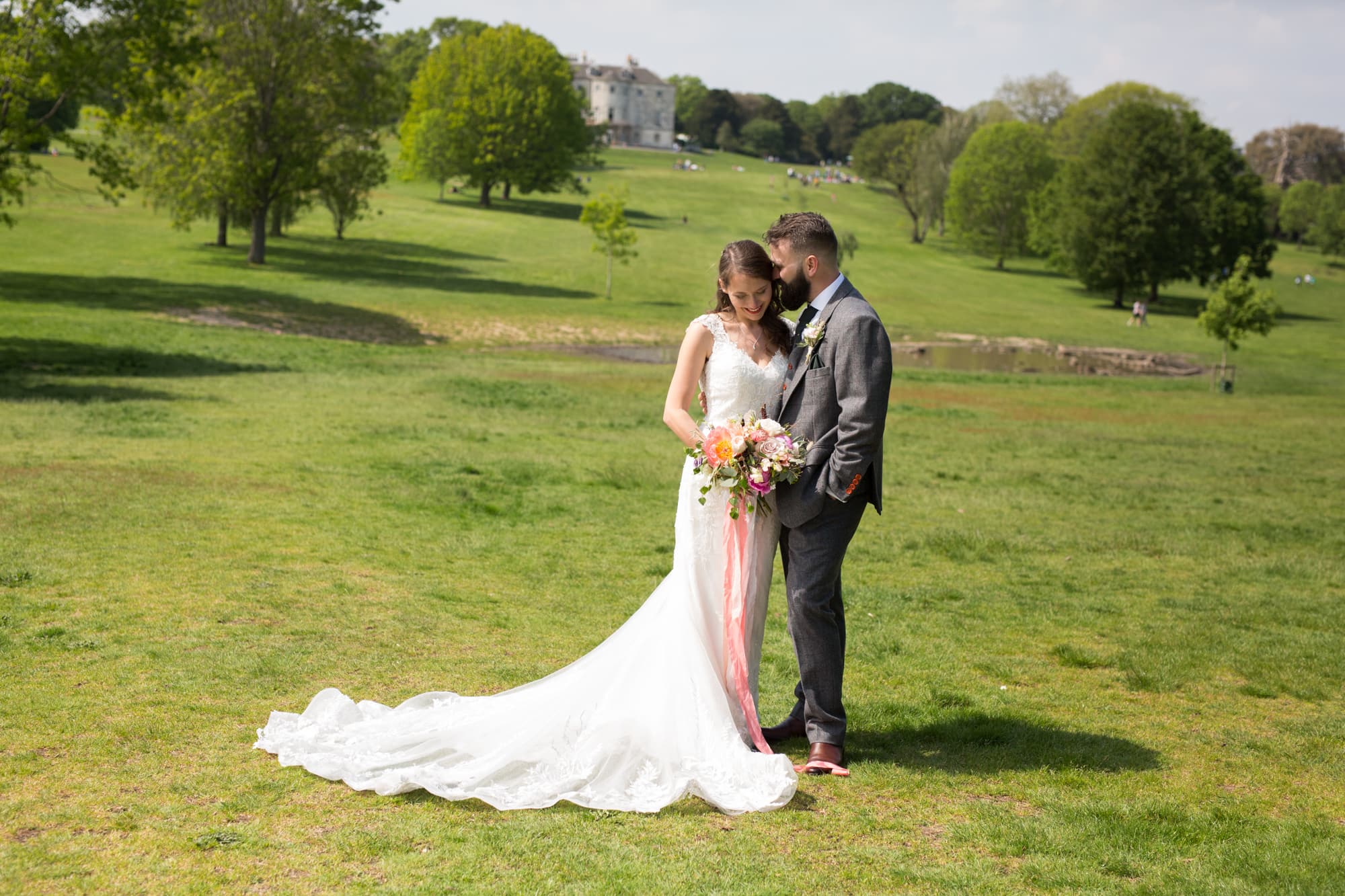 newly married couple in park taken by Beckenham wedding photographer