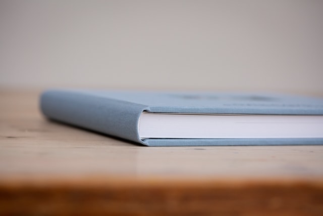 Close up view of Beckenham wedding photography album from corner in duck egg blue cover