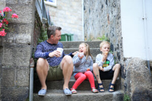 Dad and children hanging out on steps