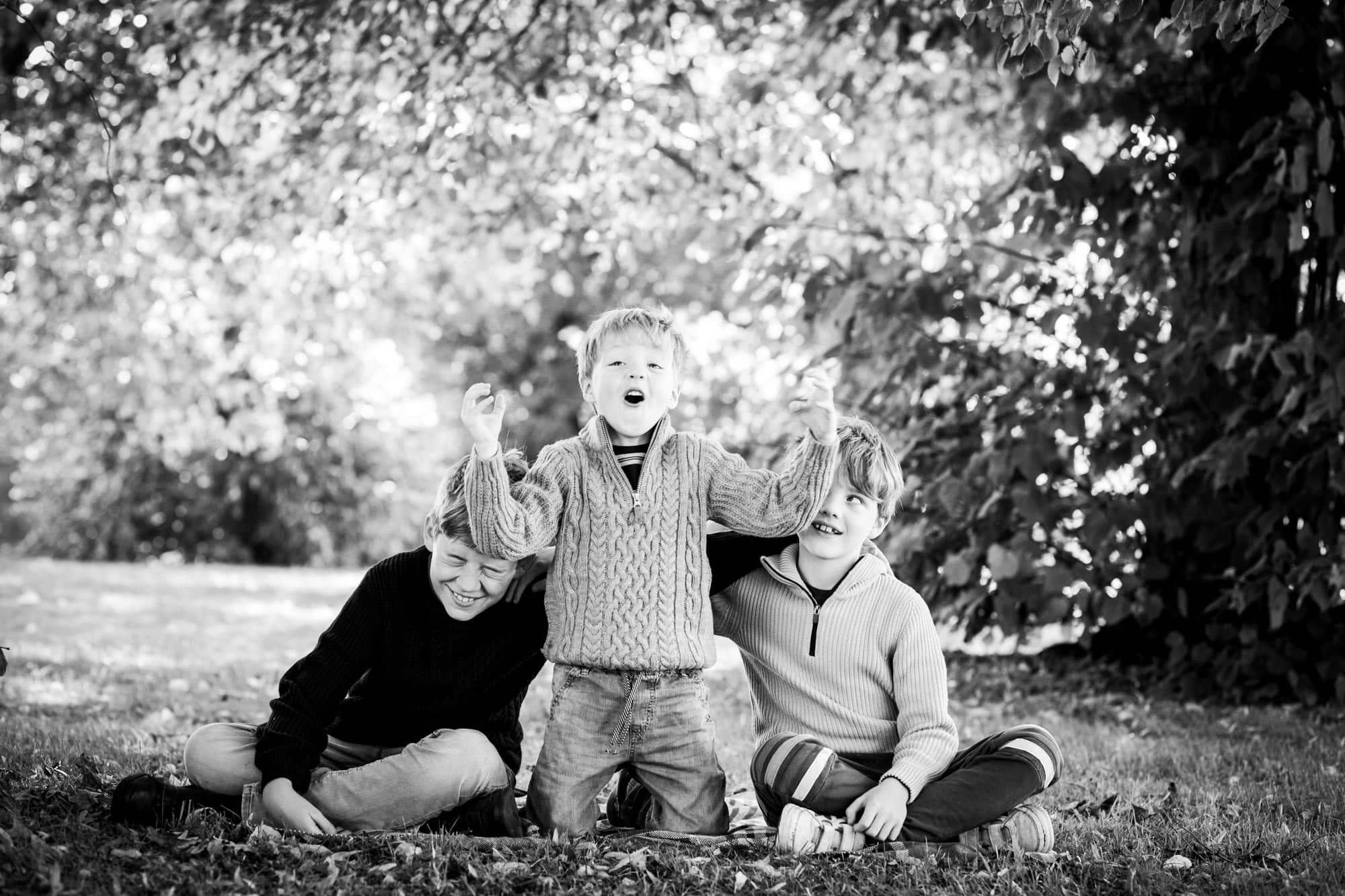 Father and son laughing in outdoor family photoshoot in London