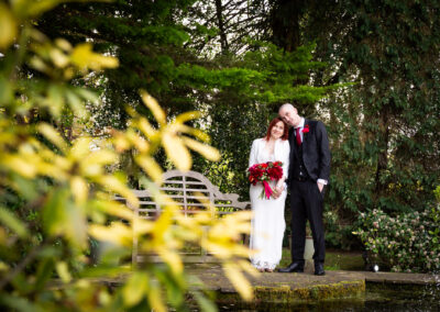 Couple embracing on wedding day at Oaks Farm Weddings venue from wedding photographer in Bromley