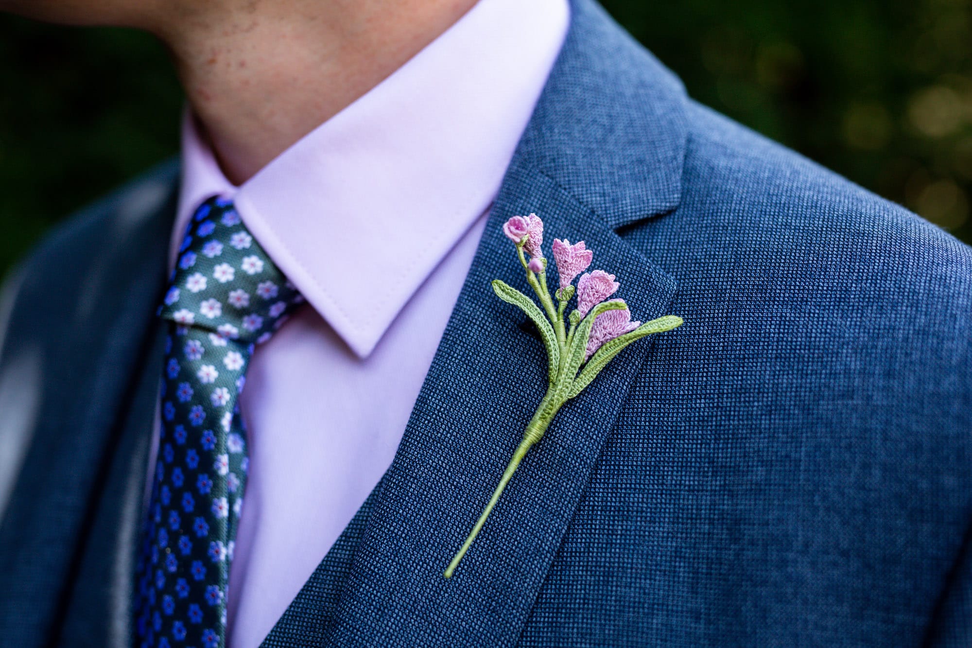 Embroidered wedding flower in grooms pocket taken by Bromley wedding photographer