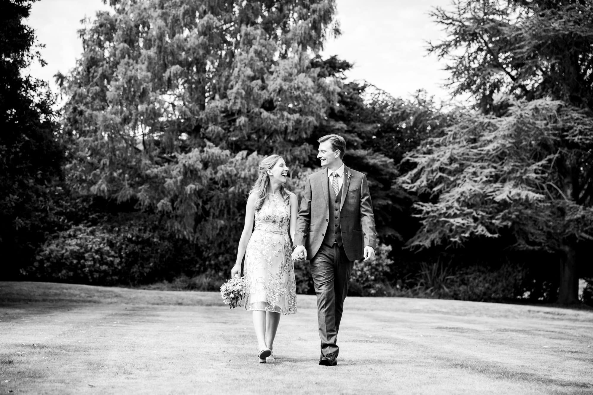 Married couple in black and white wedding photo taken by Bromley photographer at Oaks Farm Weddings venue