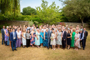 Group shot of all guests at a wedding photoshoot by Bromley photographer at Oaks Farm Weddings