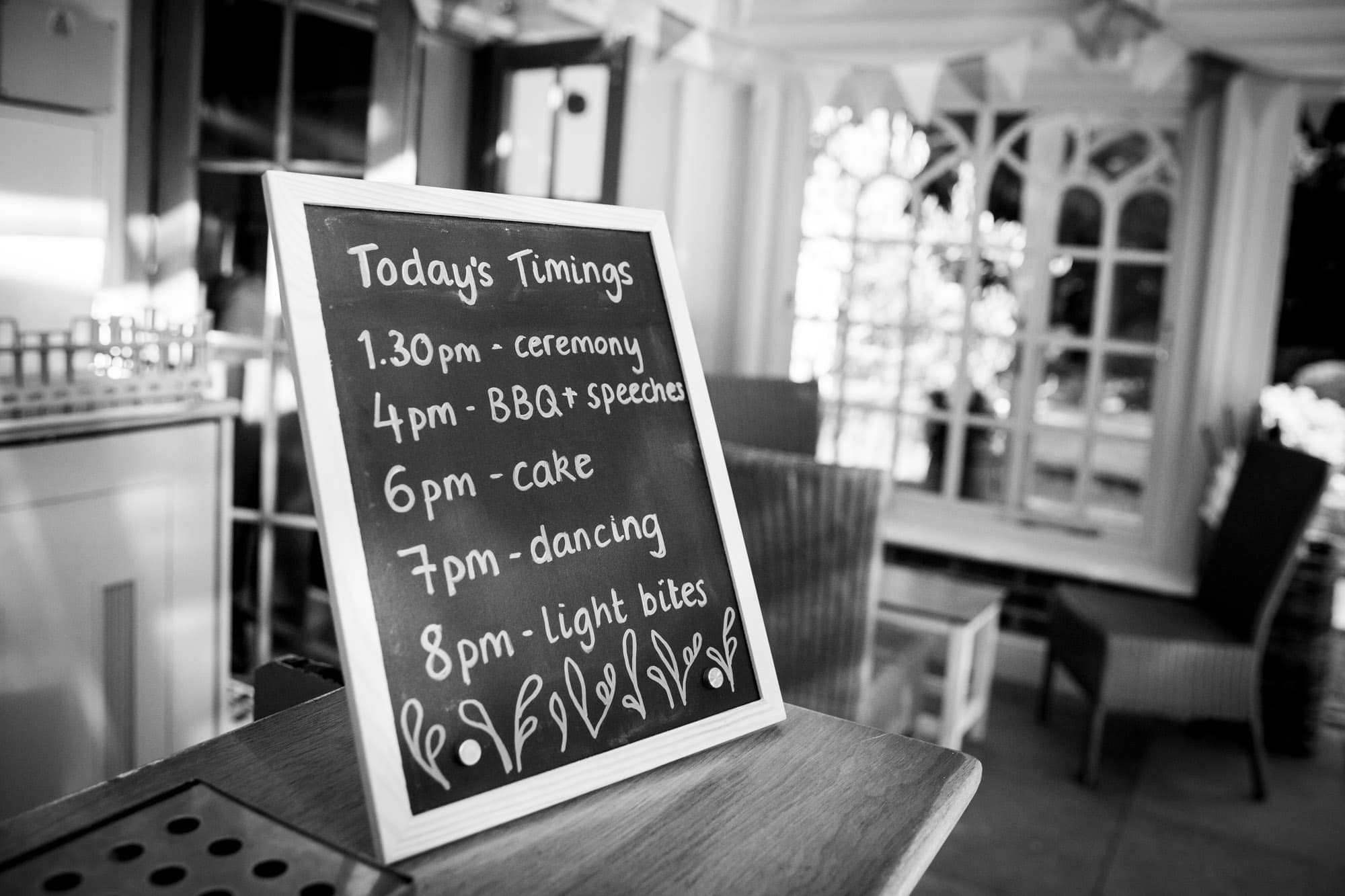 Timetable of wedding day on chalk board at Oaks Farm Weddings photoshoot